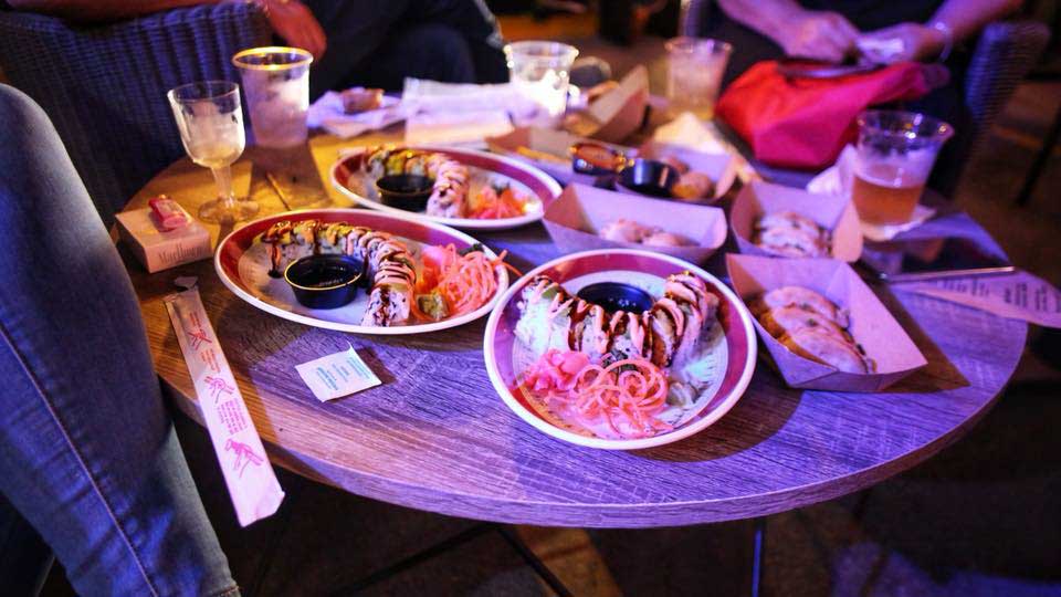 Sushi roll dishes on a table.