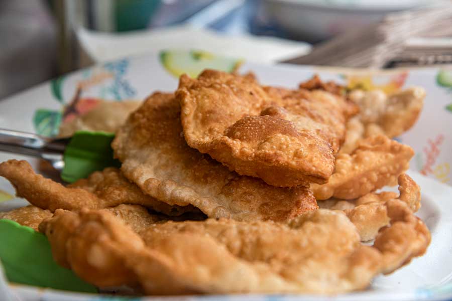 Fried empanadas on plate.