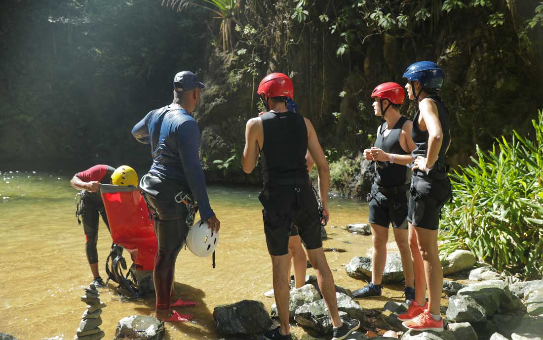 Rafters receiving instructions from guide.